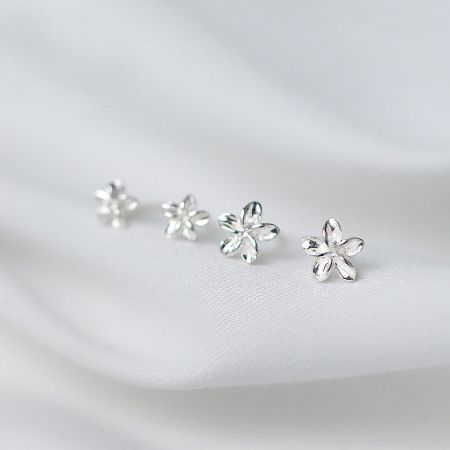 S925 Silver Small Flower Stud Earrings (5 Pairs/Set) - A set of three S925 sterling silver small flower stud earrings displayed on a textured white background, highlighting their delicate floral design.