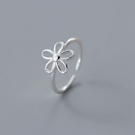 Close-up of a minimalist 925 sterling silver flower ring.