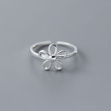 Detailed view of the sterling silver flower ring showcasing its four curved petals.