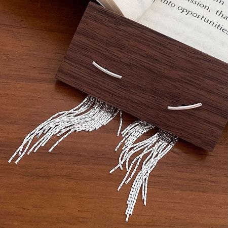 Detailed view of the 925 sterling silver fringe earrings showcasing the chain tassels.