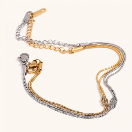 The minimalistic knot bracelets displayed in both 18K gold-plated and silver-plated finishes.
