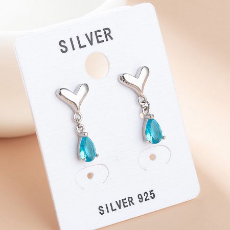 Delicate 925 silver earrings with heart studs and teardrop-shaped blue gemstones.