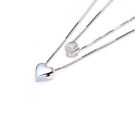 Detailed view of the Heart Stone Layered Necklace pendants