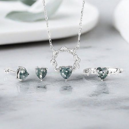 Heart Theme Jewelry Collection - A stunning heart-themed jewelry set by JR Fashion Accessories, featuring a sterling silver necklace, ring, and earrings with heart-shaped stones, perfect for wholesale collections.
