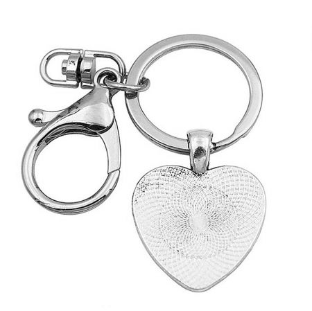 Reverse side of the silver-plated heart keychain, highlighting its sleek and polished stainless steel surface.