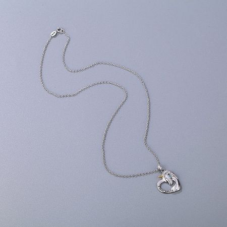 A silver necklace with a heart-shaped pendant featuring a wing design and 'FOREVER' engraving.