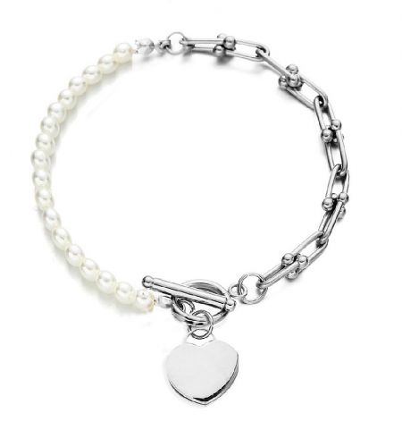 Hearty Pearl Toggle Bracelet - Hearty Pearl Toggle Bracelet in silver-toned stainless steel, featuring white pearls and a heart charm with a toggle clasp.