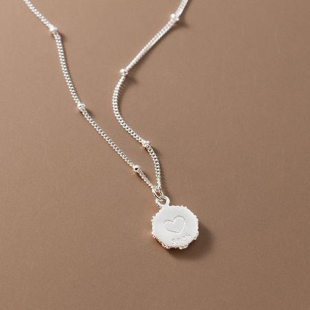 Another angle of the 925 sterling silver heart necklace, emphasizing the beaded chain design.
