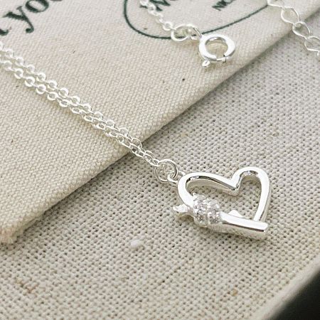 Elegant sterling silver heart pendant necklace with a single sparkling CZ stone.