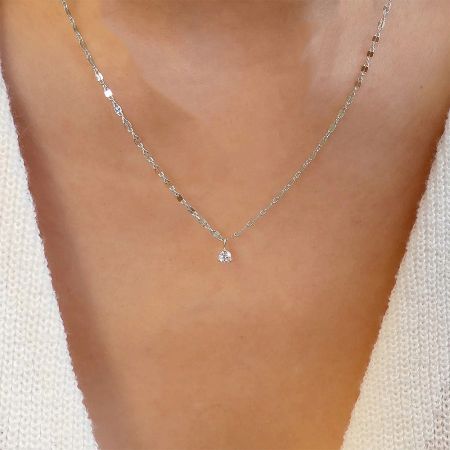A model wearing the sterling silver single stone clavicle necklace.