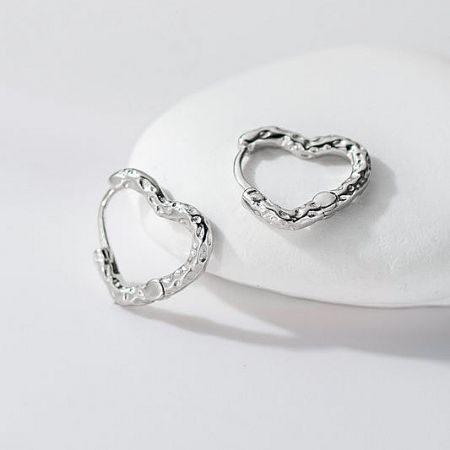 A pair of intricately textured 925 silver heart hoop earrings, a minimalist design for women's fashion.