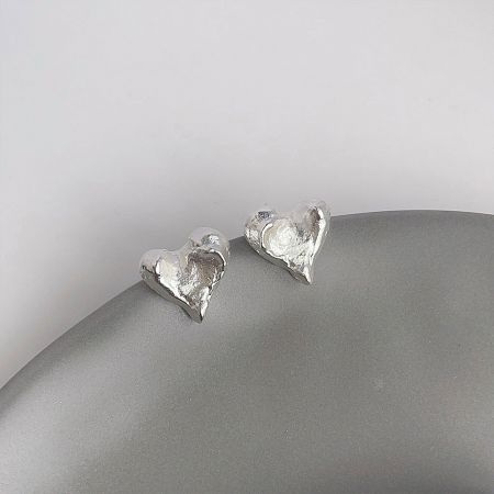 The silver-plated version of the irregular heart stud earrings, showcasing the unique design.