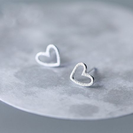 925 Sterling Silver Small Hollow Heart Stud Earrings (5 pairs) - A pair of 925 sterling silver hollow heart stud earrings with a textured finish, displayed on a clean white background.