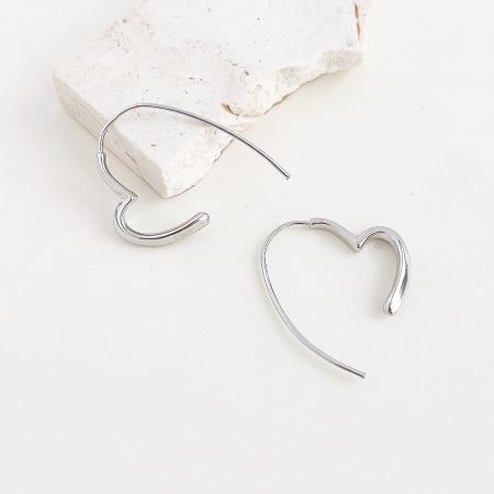 Metal Silver Color Heart Line Hoop Earrings (5 Pairs) - A pair of metal silver color heart line hoop earrings with a smooth, polished finish, displayed on a clean white background.