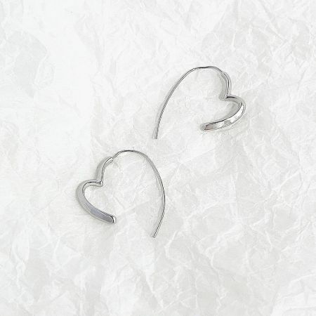 A clear product shot of the silver heart-shaped earrings against a white background.