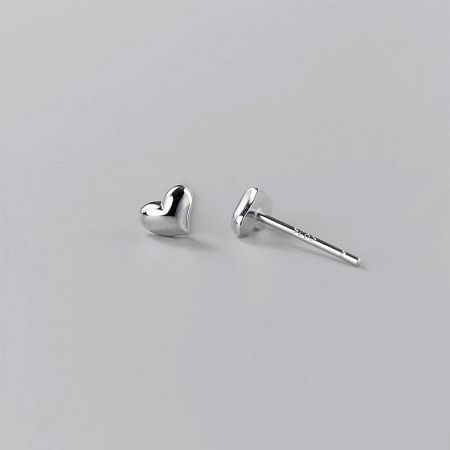 Front and back view of a pair of silver mini heart stud earrings.