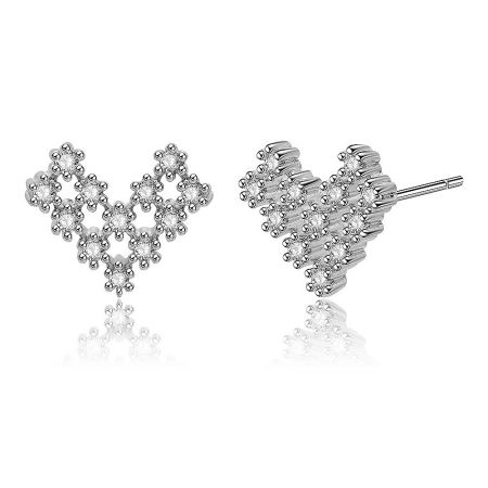 Close-up detail of the silver heart-shaped earring, highlighting the flower-like arrangement of the clear crystals.