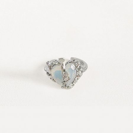 Detailed view of the silver heart-shaped opal ring.