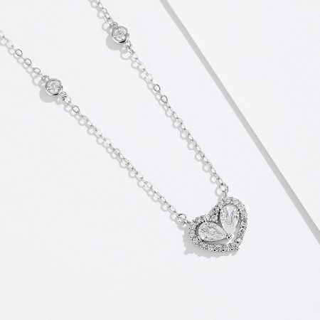 Full view of the silver heart-shaped pendant necklace with its delicate chain.