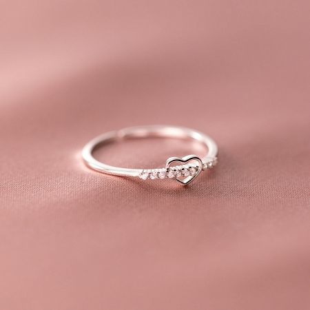 A sterling silver heart ring adorned with sparkling diamonds, from the adjustable ring set.