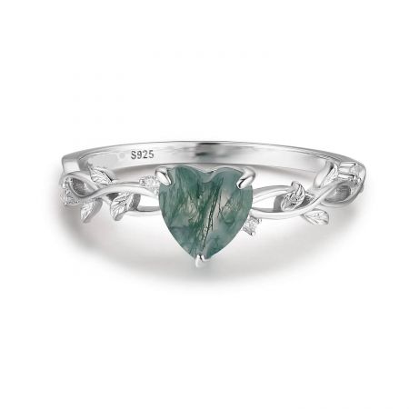 Detailed view of the sterling silver ring, showing the S925 stamp and the delicate leaf motifs surrounding the green heart stone.
