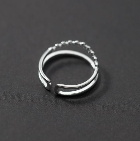 Side view of the adjustable open ring, highlighting the beaded details.