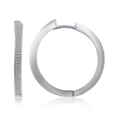 A stylistic shot of the large CZ hoop earring to show scale and design details.