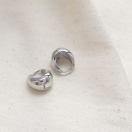 Detailed product view of the silver vintage circle teardrop hoop earrings.