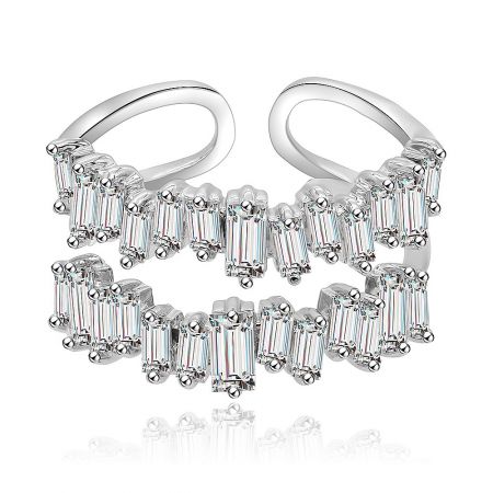 A pair of silver hoop earrings with baguette gemstones, showcasing a complementary style.