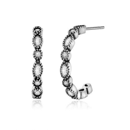 Close-up of the sterling silver half hoop earring highlighting the oval-shaped cubic zirconia.