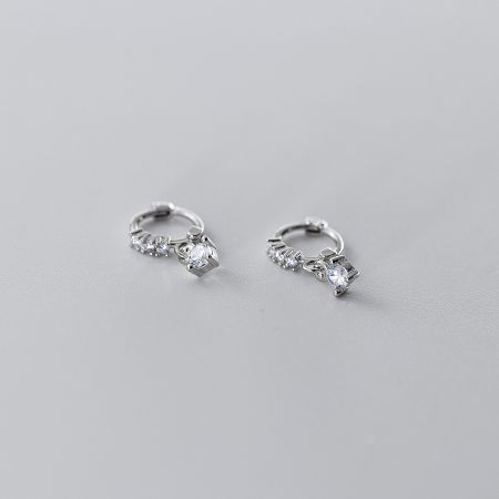 Elegant silver hoop earrings with clear gemstones, showcasing a clean and modern design.