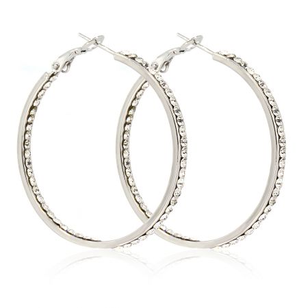 Detailed side view of the silver hoop earrings showcasing the clear crystal embellishments.