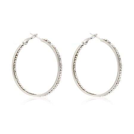 Detailed close-up view of the rhodium hoop earrings, highlighting the intricate setting of the double row of crystals.