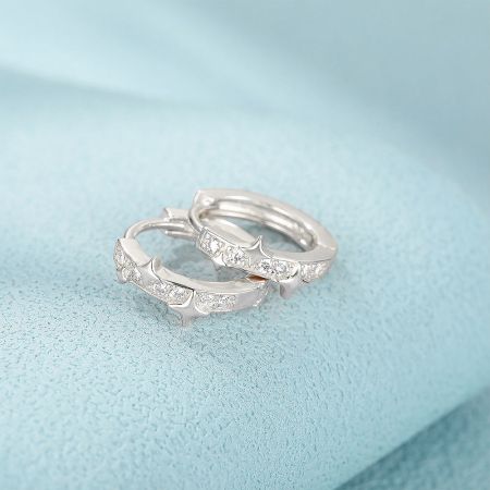 Detailed view of the sterling silver hoop earrings with brilliant CZ stones.