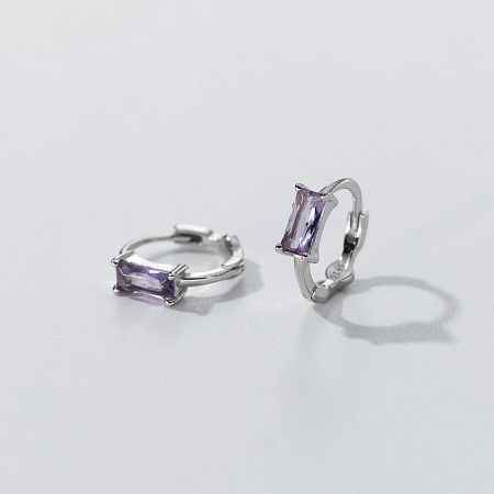 Stunning purple zircon gemstones set in polished sterling silver hoops.