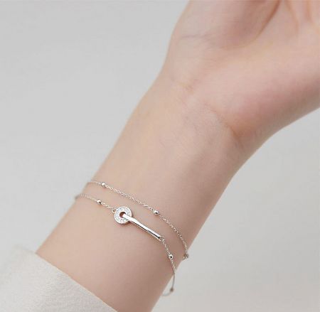 Elegant silver bracelet with a classic infinity symbol centerpiece.