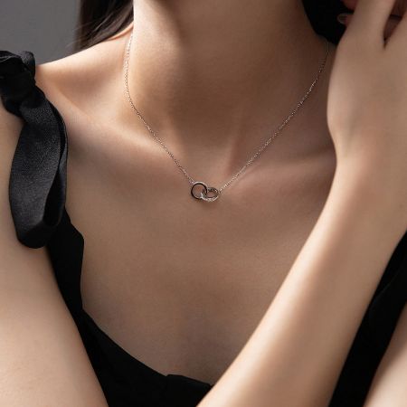 Side view of the sterling silver interlocking pendant.