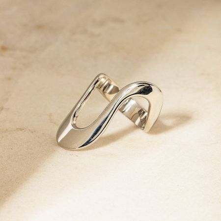Detailed view of the silver intertwined design ring from the geometric stainless steel set.