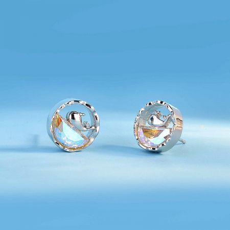 A product shot of the silver whale earrings with rainbow opals, presented on a clean white background for clarity.