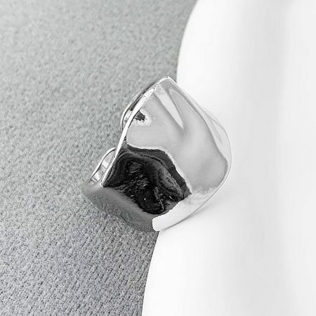 Detailed view of the unique texture on a silver geometric ring.