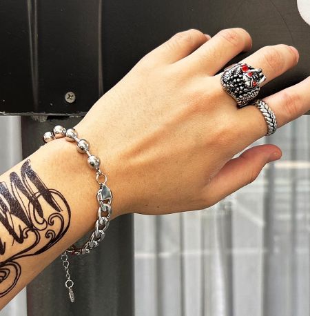 A different angle of the men's wheat ring on a model's hand, highlighting its polished finish.