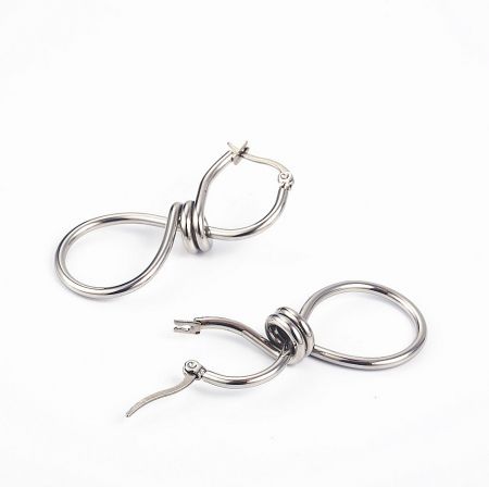 Alternative style: A pair of silver earrings with an intricate knot design, showcasing expert craftsmanship.