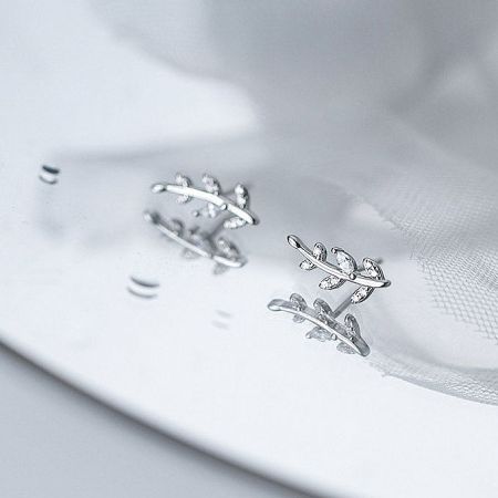 Close-up shot of the 925 silver leaf earrings highlighting the brilliant CZ zircon stones.