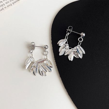 Silver Plated Leaf Statement Drop Earrings (5 Pairs) - A pair of silver-plated leaf statement drop earrings with a multi-layered, dangling leaf design, displayed on a clean white background.