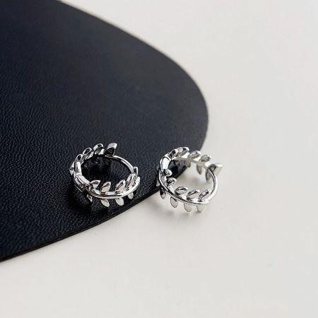 An alternative view of the silver plated leaf wreath tiny hoop earrings, highlighting the detailed craftsmanship.