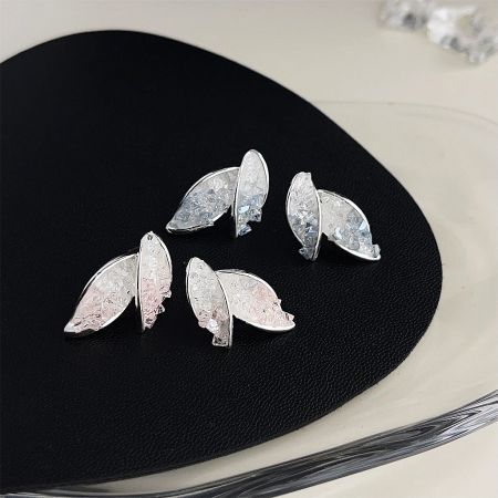 Close-up product photo of the silver leaf crystal earrings.