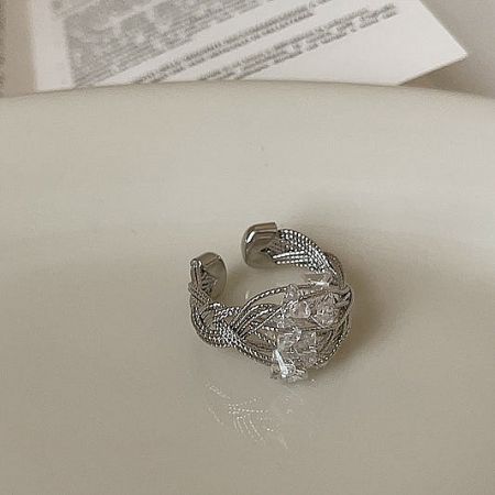 Delicate silver crystal wire-wrapped adjustable brass ring.