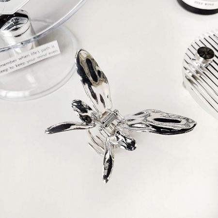 Metal Fashion Butterfly Hair Claw Clips (Set of 5) - A detailed close-up of a shiny silver metal butterfly hair claw clip, showcasing its intricate wing design and durable construction.
