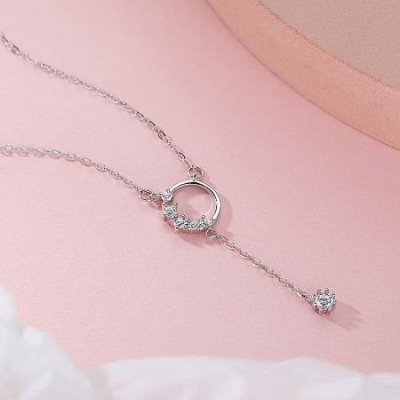 Another perspective of the sterling silver tassel necklace, emphasizing its shine and elegance.