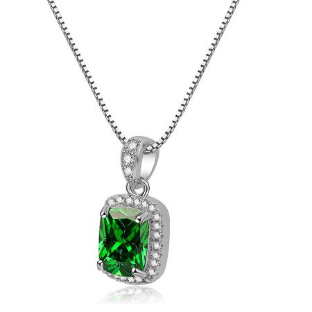 Full view of the Artistic Necklace in Emerald on a neutral background, highlighting its elegant design.